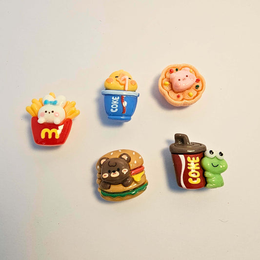 A group of croc charms with cute animals and in fast food